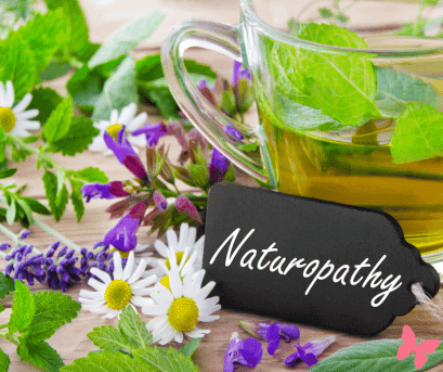 Naturopathy history. Tea and flowers with a cute little sign reading "Naturopathy"